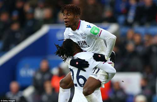 A jubilant Wilfred Zaha and Bakary Sako celebrate Crystal Palace’s 3-0 stunning win against Leicester City at the King Power Stadium.