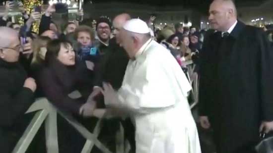 In this still frame from a video, Pope Francis slaps the hand of a woman to free himself after she forcibly grabbed the pontiff and pulled him toward her during a New Year's Eve event in St. Peter’s Square, Dec. 31, 2019.In this still frame from a video, Pope Francis slaps the hand of a woman to free himself after she forcibly grabbed the pontiff and pulled him toward her during a New Year's Eve event in St. Peter’s Square, Dec. 31, 2019. Vatican TV