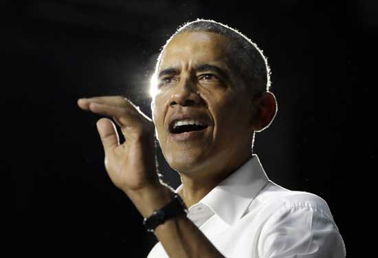 File photo, former President Barack Obama speaks during a campaign rally for Democratic candidates in Miami.