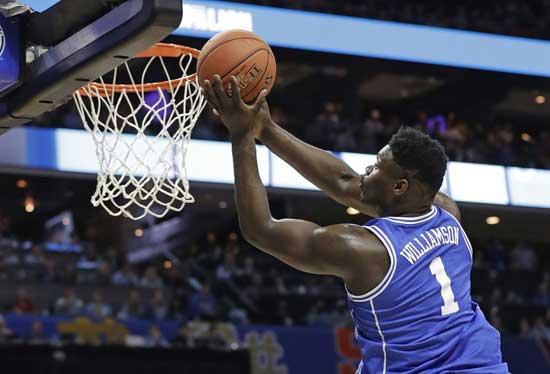 Duke's Zion Williamson (1) drives to the basket against North Carolina during the first half of an NCAA college basketball game in the Atlantic Coast Conference tournament in Charlotte, N.C., Friday, March 15, 2019. (AP Photo/Chuck Burton)