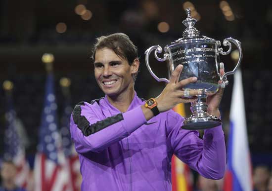  Rafael Nadal, of Spain, holds up the championship trophy after defeating Daniil Medvedev, of Russia, to win the men's singles final of the U.S. Open tennis championships Sunday, Sept. 8, 2019, in New York. (AP Photo/Charles Krupa)