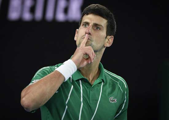 Serbia's Novak Djokovic celebrates after defeating Austria's Dominic Thiem in the final of the Australian Open tennis championship in Melbourne, Australia, Sunday, Feb. 2, 2020. (AP Photo/Andy Brownbill)