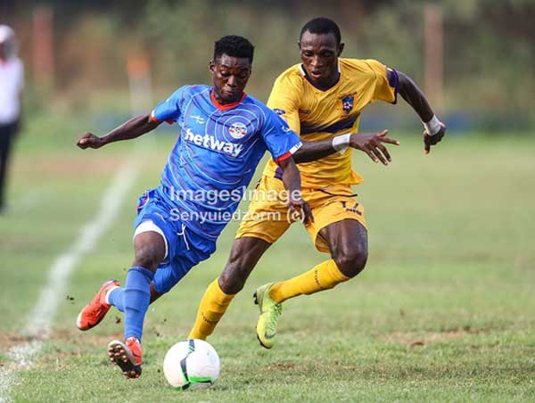 A Medeama SC player (yellow and mauve) and a Liberty Profs player fight for the ball in their Ghana Premier League Week 03 encounter played at Dansoman’s Carl Reindorf Park on January 11th 2020. Image credit – Images_image