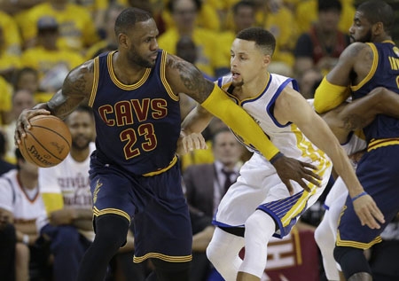 Stephen Curry, right, guarding Cleveland's LeBron James, had just 11 points in Game