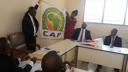 GFA officials open up the CAF flag/banner