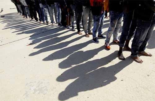 Migrants stand at a naval base after they were rescued by the Libyan coastguard, in Tripoli, Libya October 18, 2017. Photo - Reuters