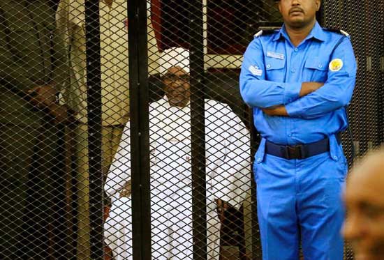 Former Sudanese president Omar Hassan al-Bashir sits inside a cage during the hearing of the verdict that convicted him of corruption charges in a court in Khartoum, Sudan. December 14, 2019. Reuters/Mohamed Nureldin Abdallah