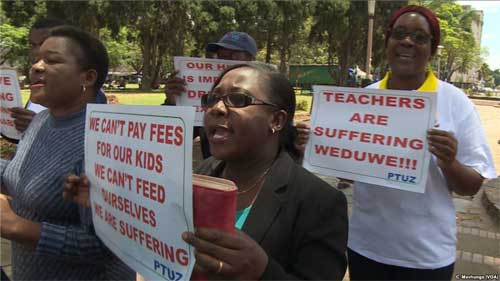 Teachers demanding to be paid in U.S. dollars take to the streets in Harare, Zimbabwe, Nov. 9, 2018.