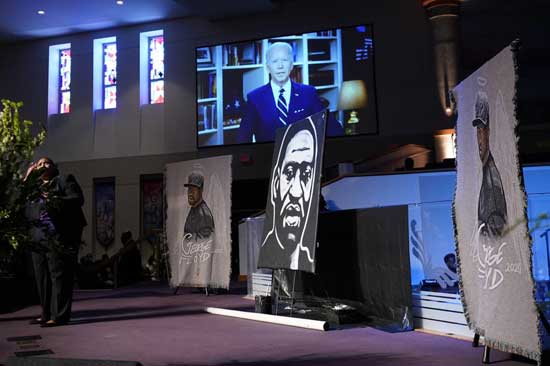 Democratic presidential candidate, former Vice President Joe Biden speaks via video link as family and guests attend the funeral service for George Floyd at The Fountain of Praise church Tuesday, June 9, 2020, in Houston. (AP Photo/David J. Phillip, Pool)