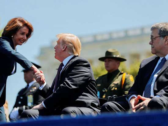President Donald Trump shakes hands with Speaker of the House Nancy Pelosi while Attorney General William Barr looks on as they all attend the 38th Annual National Peace Officers Memorial Service on Capitol Hill, May 15, 2019.