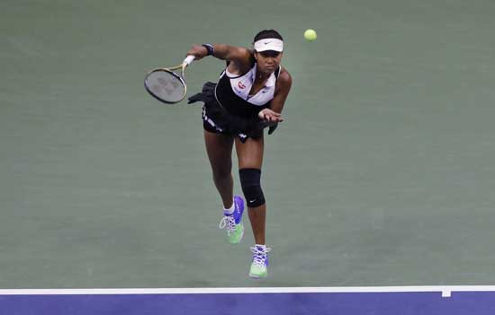 Naomi Osaka, of Japan, serves against Belinda Bencic, of Switzerland, during the fourth round of the US Open tennis championships Monday, Sept. 2, 2019, in New York. (AP Photo/Frank Franklin II)