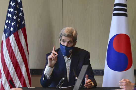 In this photo provided by U.S. Embassy Seoul, U.S. special envoy for climate John Kerry speaks during a round table meeting with the media in Seoul, South Korea, Sunday, April 18, 2021. The United States and China, the world's two biggest carbon polluters, have agreed to cooperate with other countries to curb climate change, just days before U.S. President Joe Biden hosts a virtual summit of world leaders to discuss the issue. (U.S. Embassy Seoul via AP)