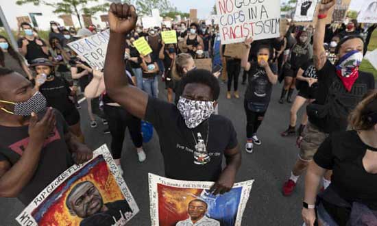 Protesters protest against the death of George Floyd, systemic racism, and other injustices at the University of Massachusetts in Boston. June 6, 2019. AP photo