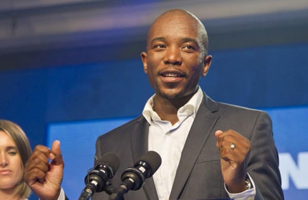 Newly elected Democratic Alliance (DA) party leader Mmusi Maimane, delivers his victory speech after being elected leader Sunday, May 10, 2015 in Port Elizabeth, South Africa. South Africa's main opposition group on Sunday chose its first black leader at a party congress, seeking to expand its appeal in a country whose ruling party has dominated since the first all-race elections in 1994.